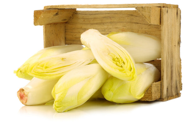 Fresh chicory in a wooden crate