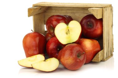 Fresh and delicious red Ambrosia apples and a cut one clipart