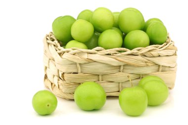 Fresh jujube fruit (Ziziphus jujuba) in a woven basket clipart