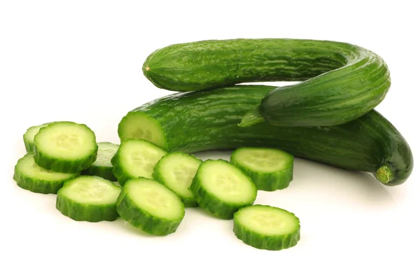 Bunch of curly turkish cucumbers and some cut pieces — Stock Photo, Image