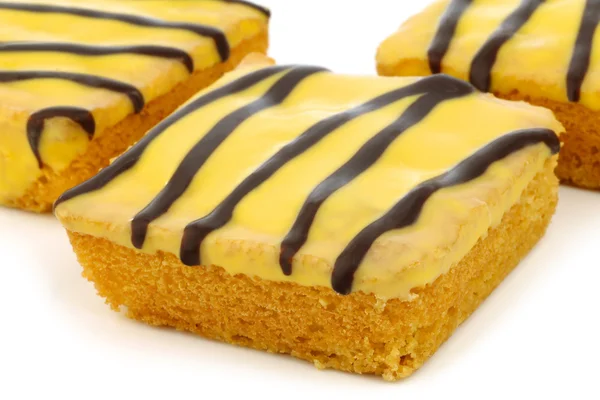 Traditional Dutch easter cake with yellow glazing and chocolate stripes — Stock Photo, Image