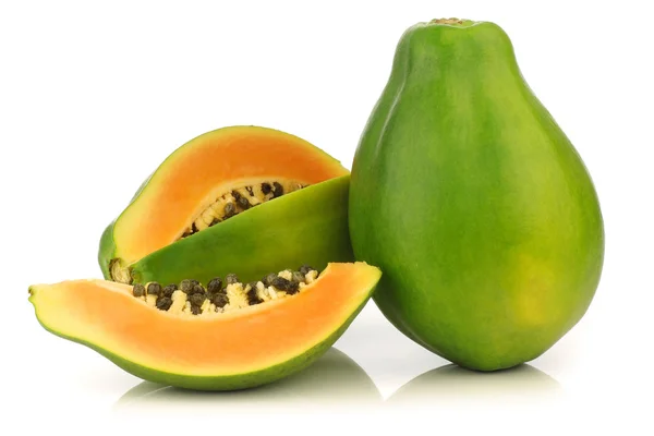 Fresh papaya fruit and a cut one — Stock Photo, Image