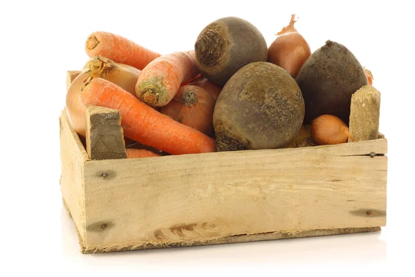 Variety of root vegetables in a wooden crate — Stock Photo, Image