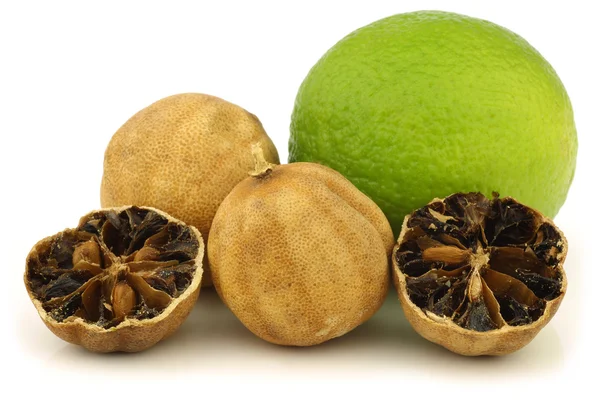 Cut dried "white lime" fruit and a fresh one — Stock Photo, Image