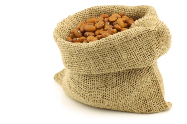 Brown beans in a burlap bag — Stock Photo, Image