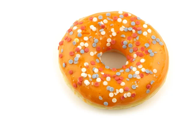 Помаранчевий пончик з червоними, білими та синіми зморшками — стокове фото