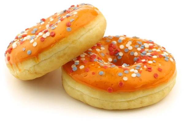 Donuts de laranja com polvilhas vermelhas, brancas e azuis — Fotografia de Stock