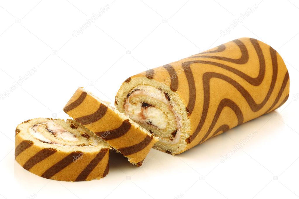Decorated blueberry cream pastry roll and some cut pieces