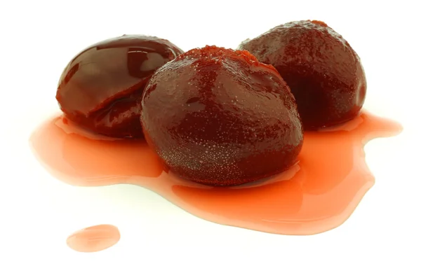 stock image Colorful prunes on syrup