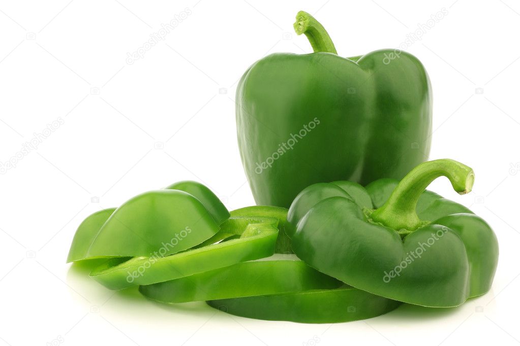 Fresh green bell pepper (capsicum) and a cut one