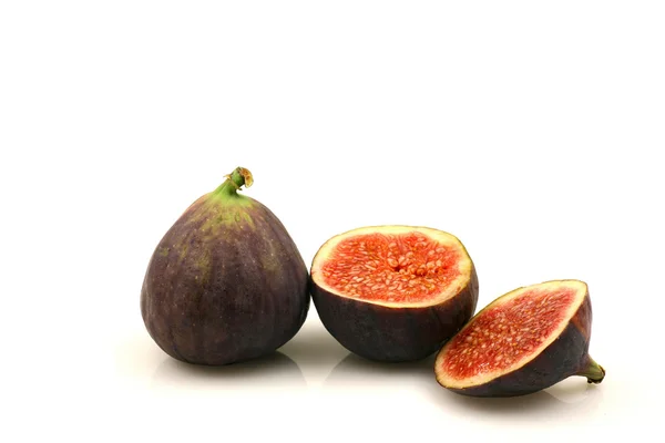 One whole and one sliced fig — Stock Photo, Image