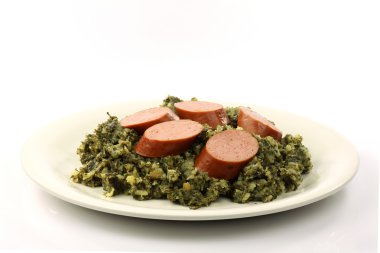 Stew of potatoes and kale with smoked sausage clipart