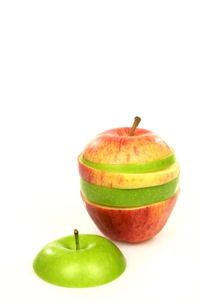Two sliced apples put together and one green apple cap — Stock Photo, Image