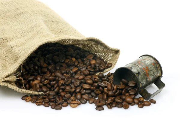 Miarka i płótnie torby z ziaren kawy — Zdjęcie stockowe