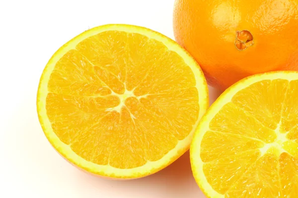 One whole and two slices of an orange — Stock Photo, Image