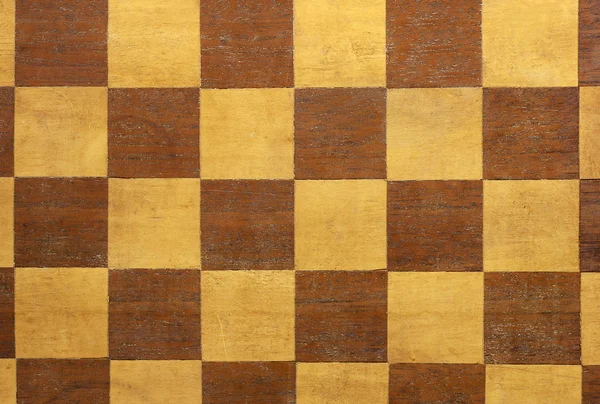 stock image Old and aged wooden chessboard