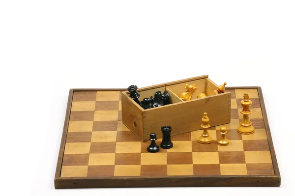 Old and aged wooden chessboard with box and chess pieces — Stock Photo, Image