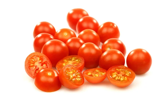 Whole and sliced cherry tomatoes — Stock Photo, Image