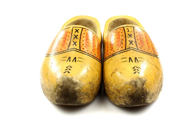 Pair of traditional Dutch yellow wooden shoes — Stock Photo, Image