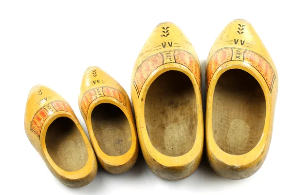 Starý a mladý dva páry tradiční holandský žlutý dřevěné obuvi — Stock fotografie