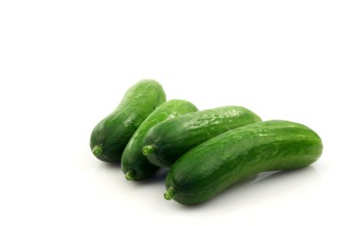 Fresh green baby cucumbers you can eat as a snack clipart