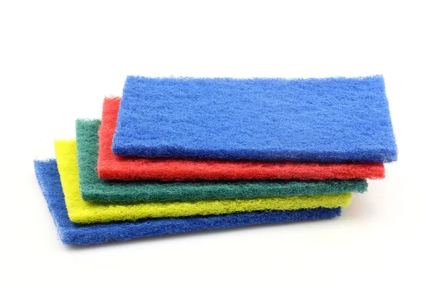Almohadillas abrasivas azules, rojas, verdes y amarillas — Foto de Stock