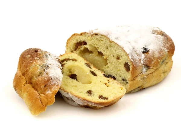 Freshly baked and sliced easter stollen with currents filled with almond paste — Stock Photo, Image
