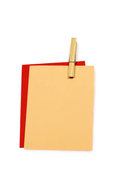 Colorful writing paper held together with a clothespin — Stock Photo, Image