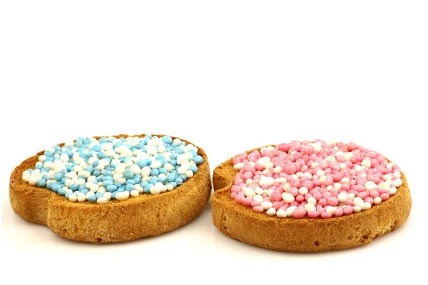 Rusks with white and blue and white and pink anise seed sprinkles — Stock Photo, Image