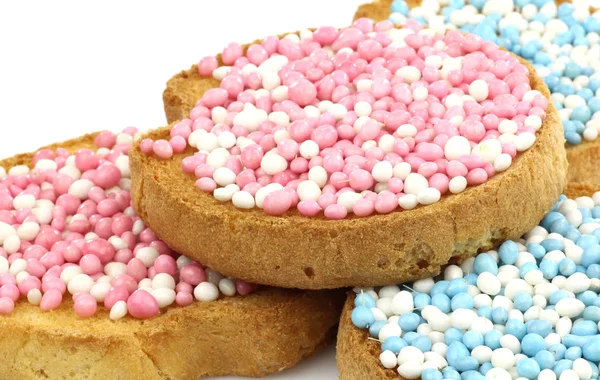Rusks with white and blue and white and pink anise seed sprinkles — Stock Photo, Image