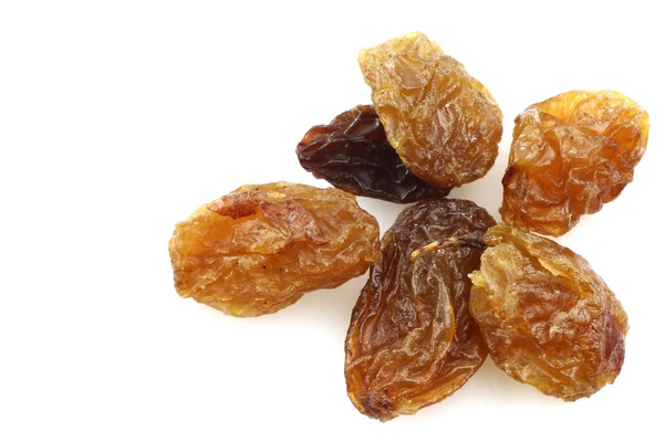 Close up of a few dried raisins — Stock Photo, Image