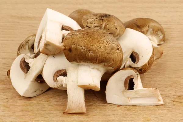 A bunch of cut brown champignons — Stock Photo, Image
