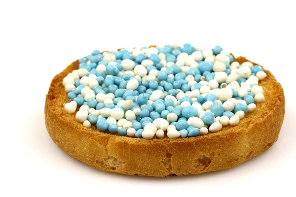 stock image A rusk with blue and white anise seed sprinkles