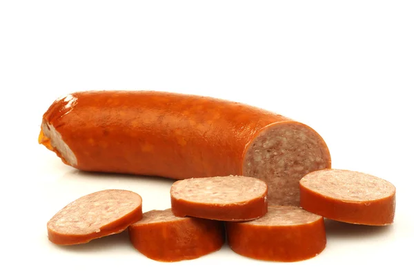 Cut smoked sausage with some pieces — Stock Photo, Image