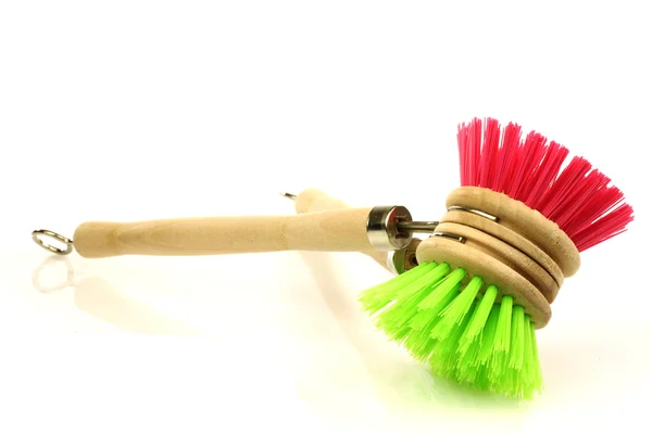 A red and green dish washing brush — Stock Photo, Image