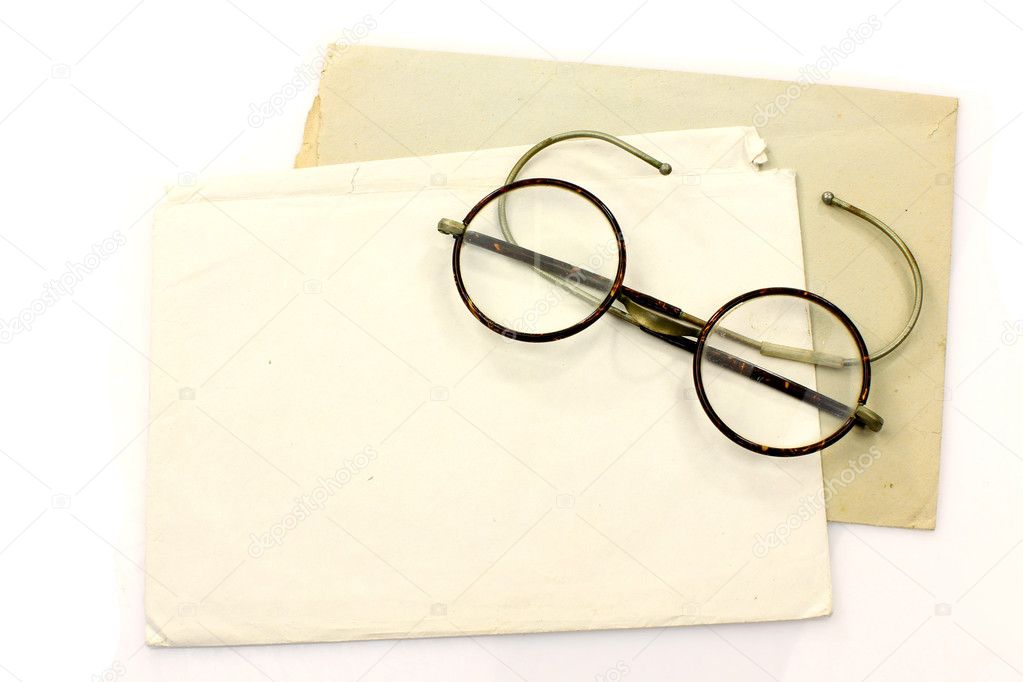 Old envelopes and a pair of vintage glasses