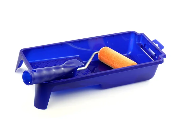 Blue plastic paint pan and a paint roller — Zdjęcie stockowe