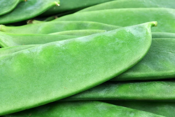 Green pea pods background — Stock Photo, Image