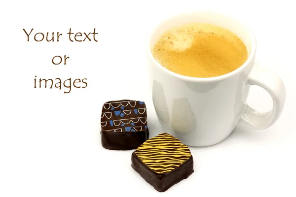 Fresh cup of coffee and two bonbons with room for tour text or images — Stock Photo, Image