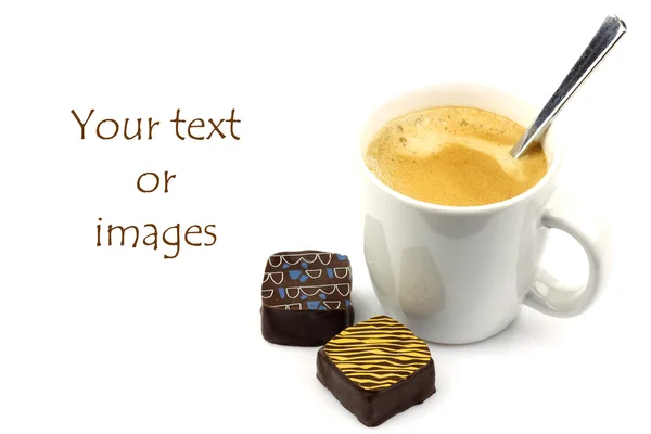 Fresh cup of coffee, a spoon and two bonbons with room for tour text or images — Stock Photo, Image