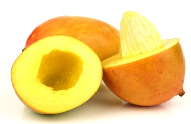 Two fresh mango fruits with one cut and seed visible clipart