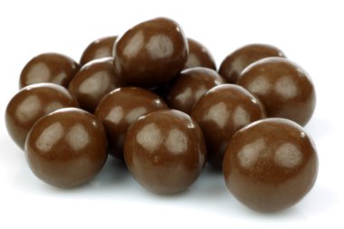 Chocolate balls filled with hazelnuts clipart