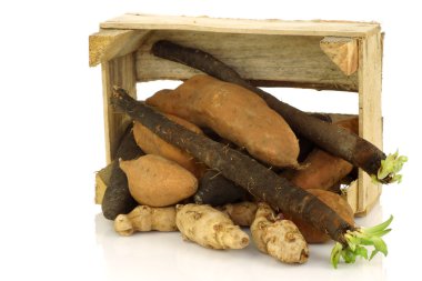 Bunch of mixed vegetables coming out of a wooden box clipart