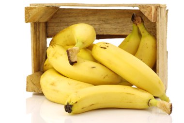 Fresh bananas in a wooden crate clipart