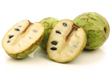 Fresh cherimoya fruit (Annona cherimola) and a cut one clipart