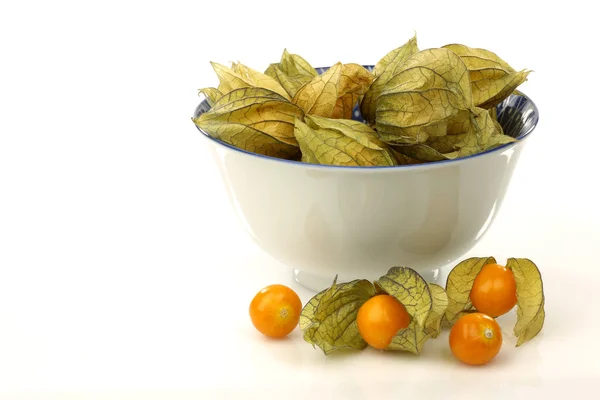 stock image A white bowl with physalis fruit (Physalis peruviana)