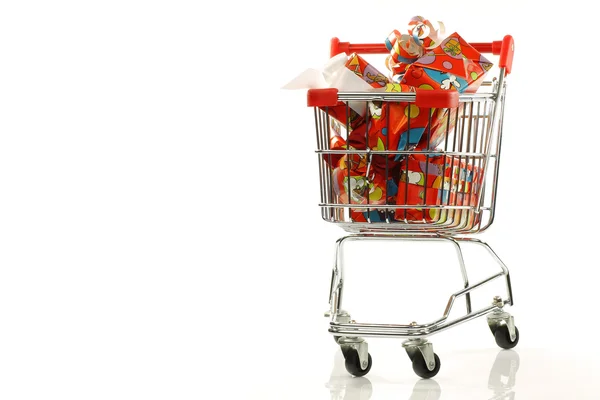 Shopping cart with colorful wrapped "Sinterklaas"presents — Stock Photo, Image