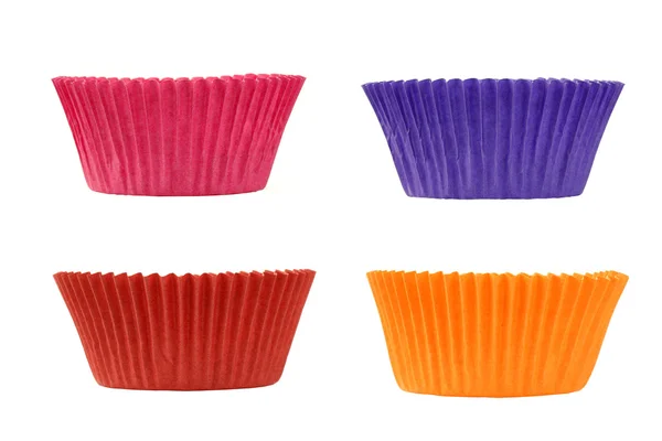 Vier kleurrijke lege muffin cups — Stockfoto