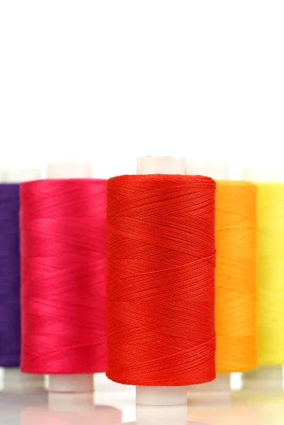 Colorful spindles of yarn — Stock Photo, Image