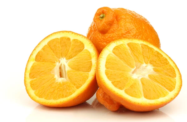 One fresh minneola and a cut one — Stock Photo, Image